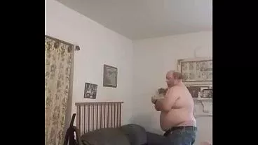 Pants down playing with vacuum cleaner