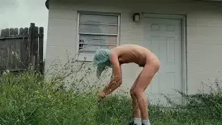 twink trimming the grass naked outside